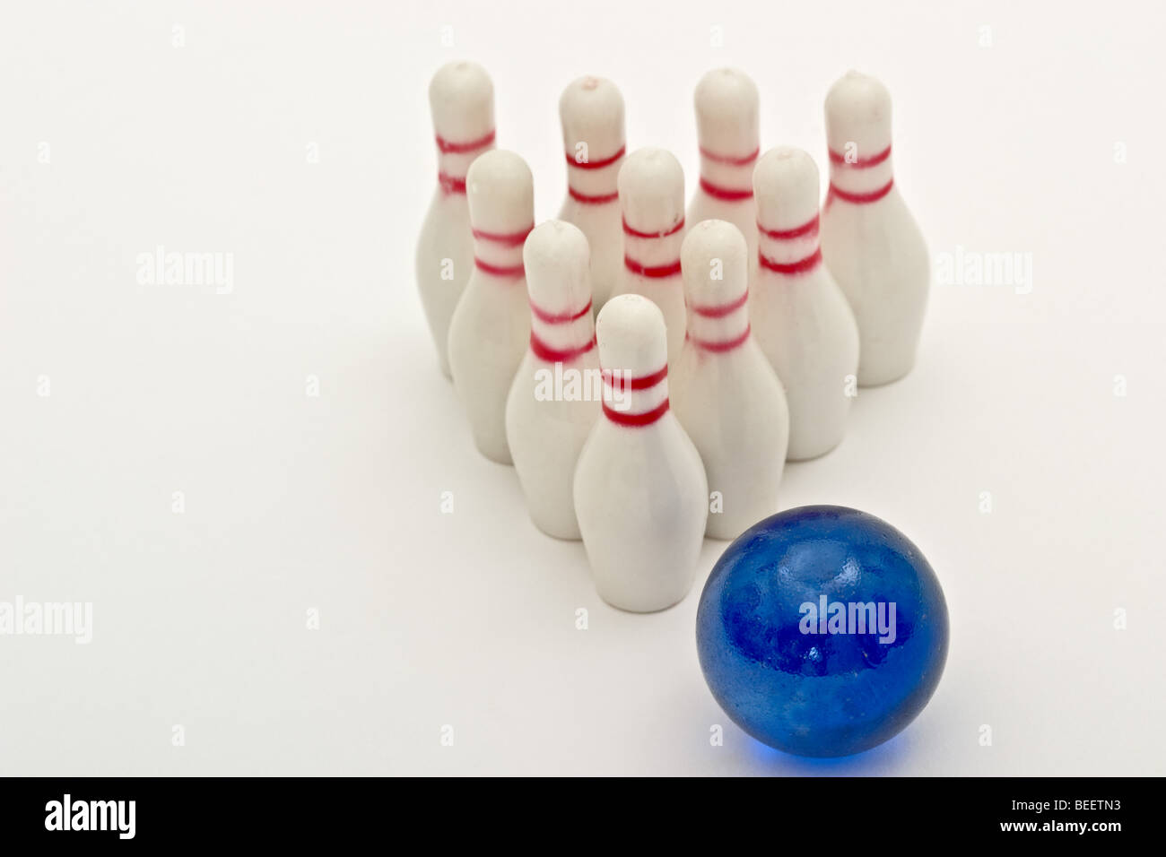 Small toy bowling ball heading for 10 pins Stock Photo Alamy