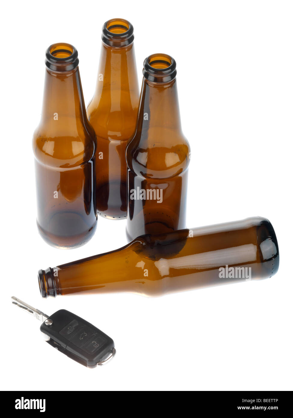 Empty Beer Bottles with Car Keys Stock Photo