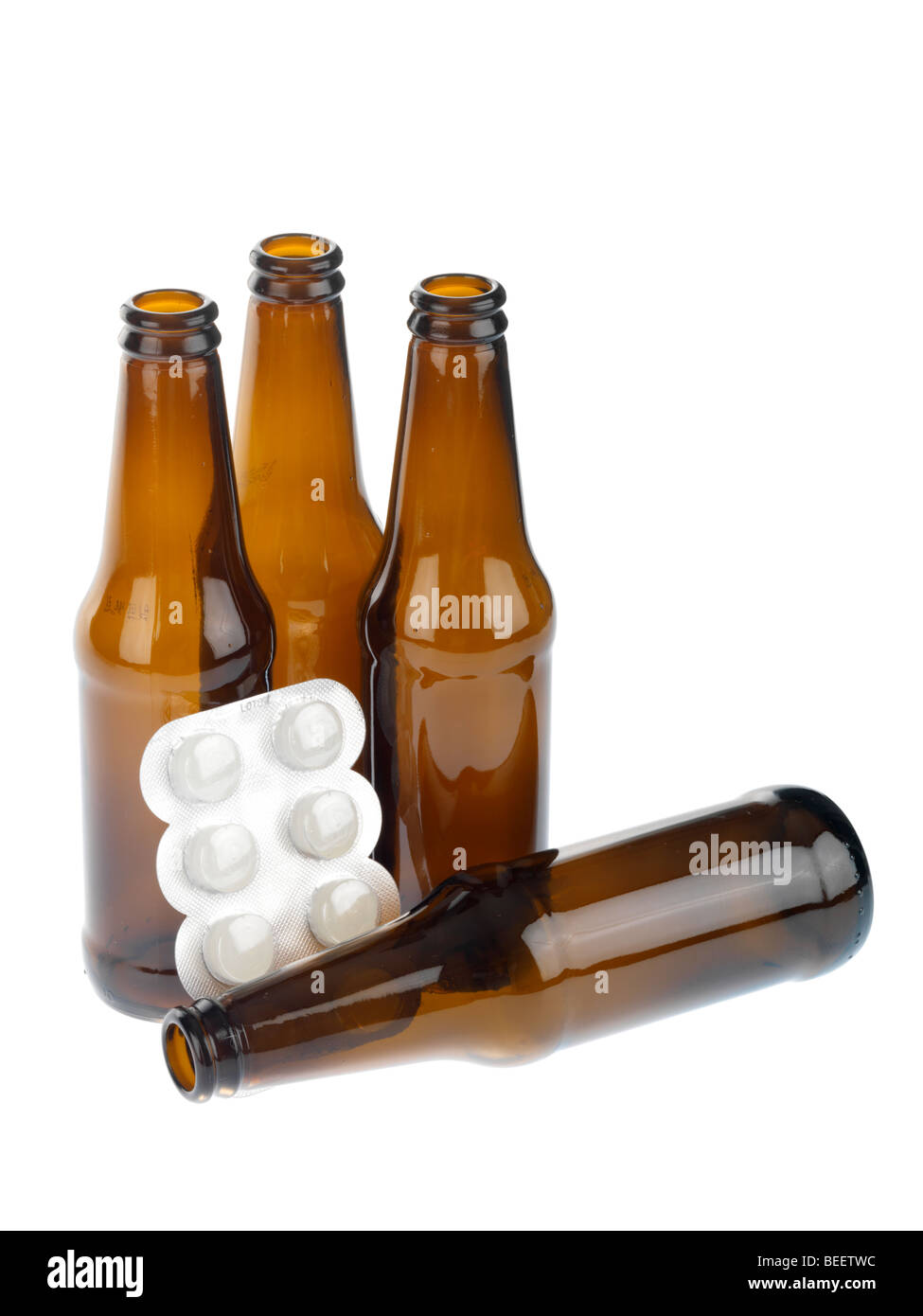 Empty Beer Bottles with Pills Stock Photo