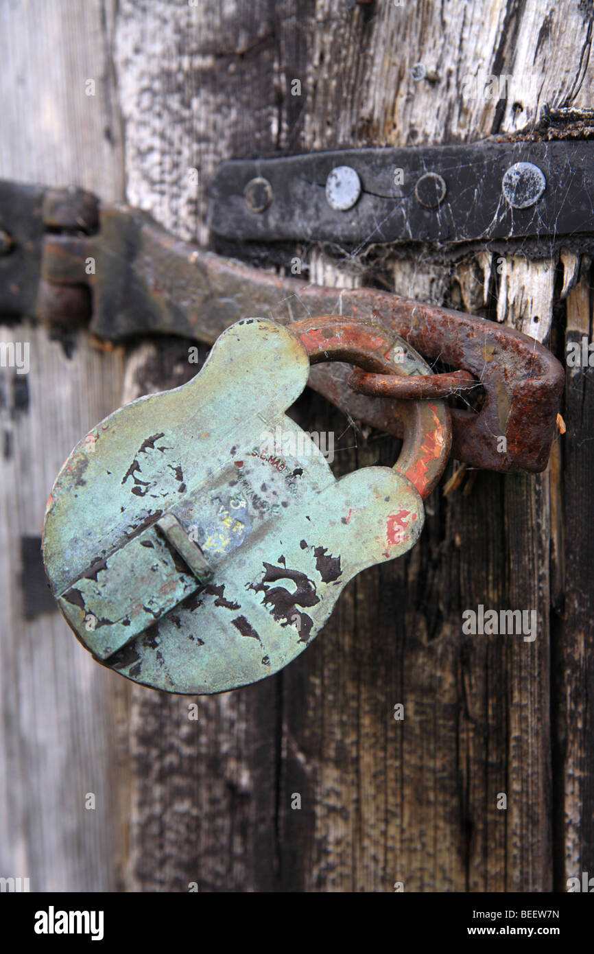 'Old padlock' on wooden shed, clasp and lock. Stock Photo