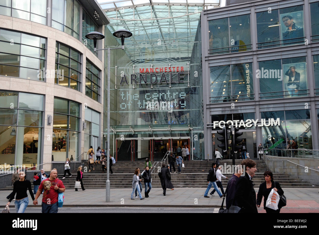 Shoppers outside the Manchester Arndale Centre, the main shopping centre in Manchester, England, UK Stock Photo