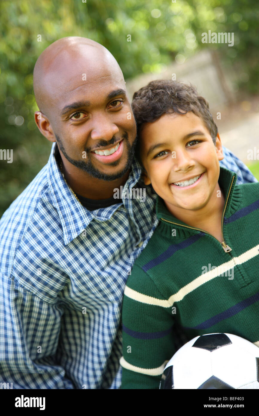 Portrait of father and son outdoors Stock Photo