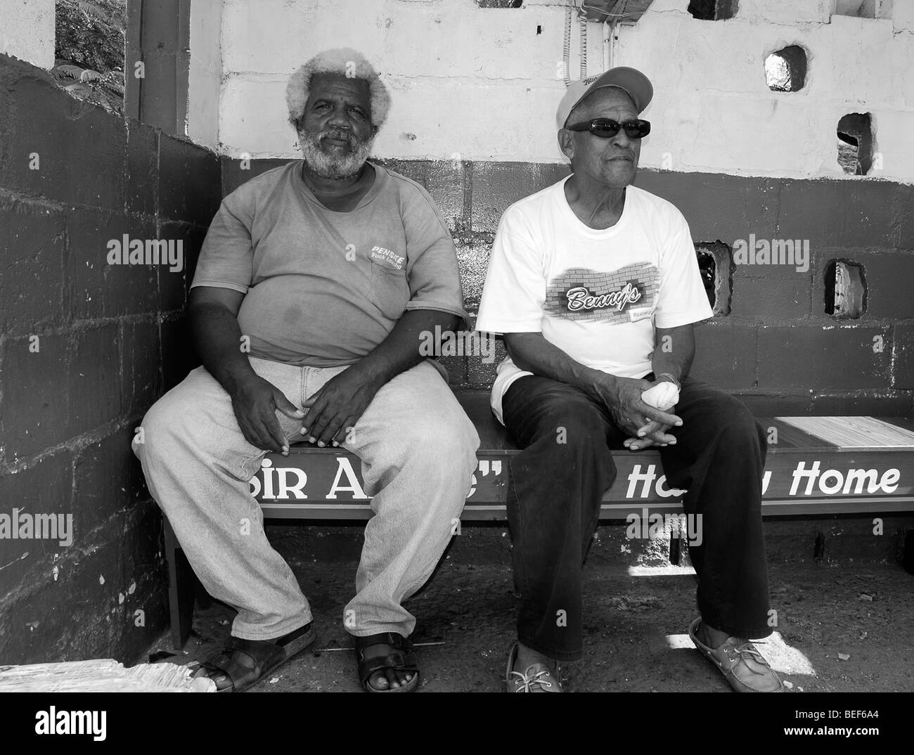 two old men waiting for the bus, Belize City Stock Photo - Alamy