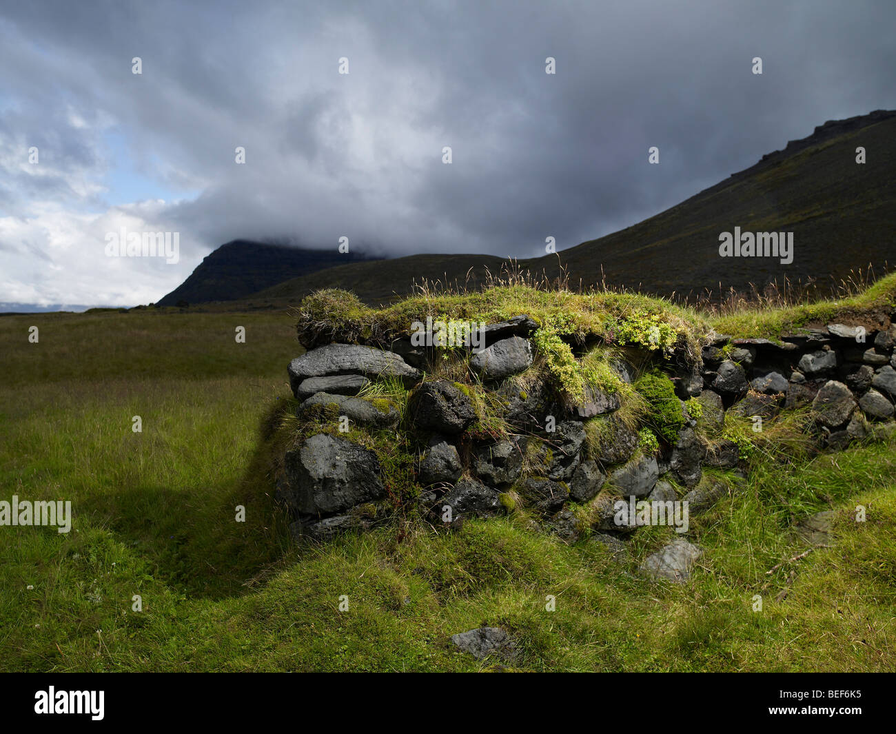 Ruins of old stone wall, Eastern Iceland Stock Photo