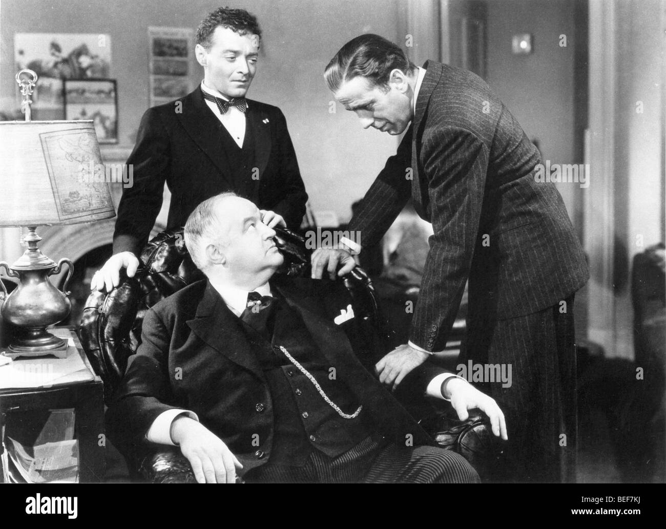 (L-R) PETER LORRE, SYDNEY GREENSTREET, and HUMPHRY BOGART in a scene from the 1941 movie, 'The Maltese Falcon.' Stock Photo