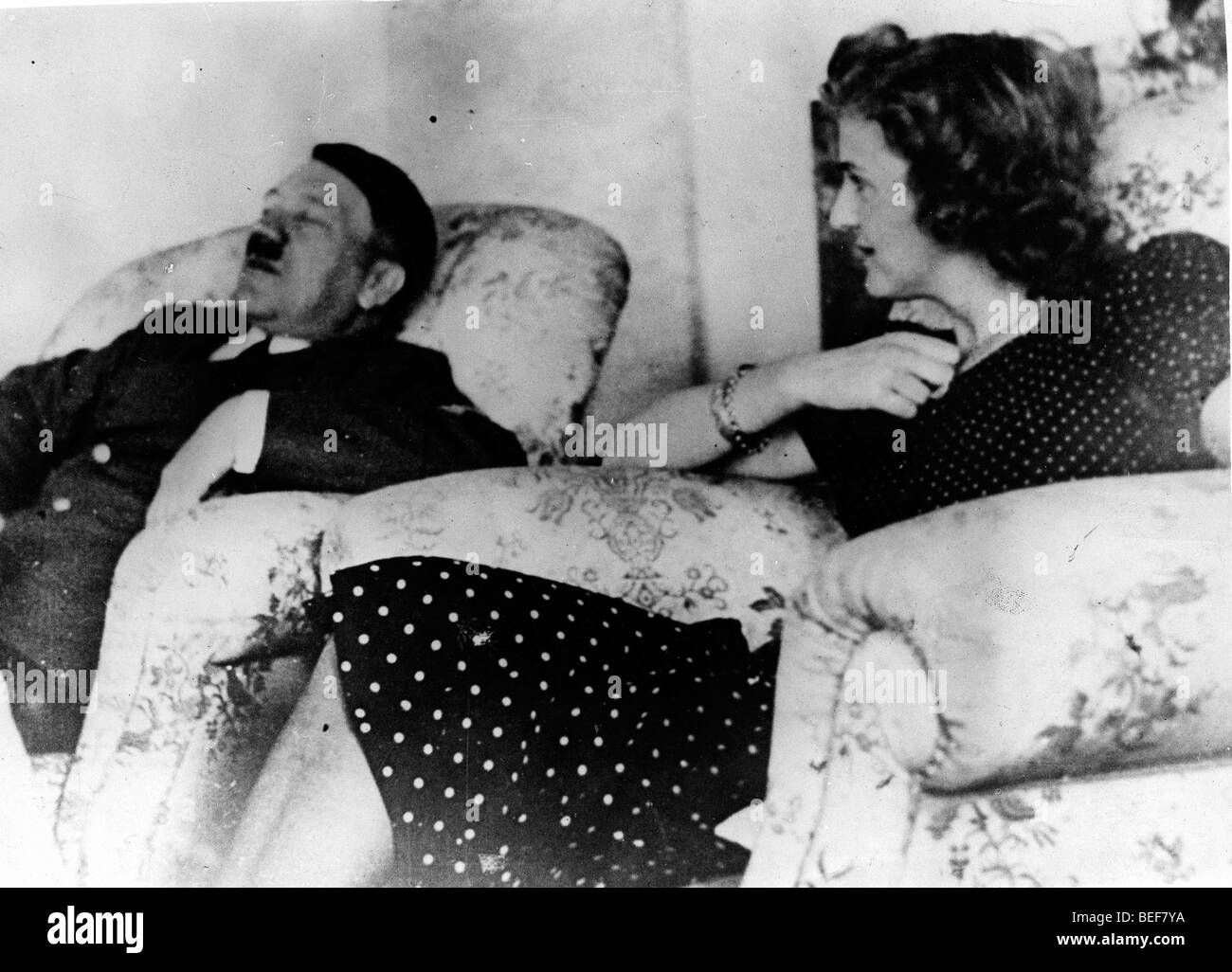Adolf Hitler and Eva Braun relax in comfortable chairs. Stock Photo