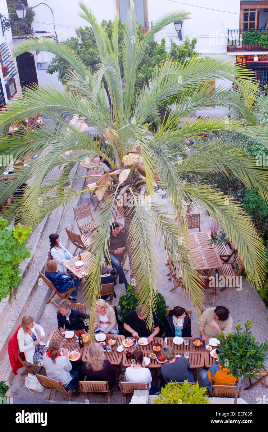 people eating outside in square Spain Stock Photo