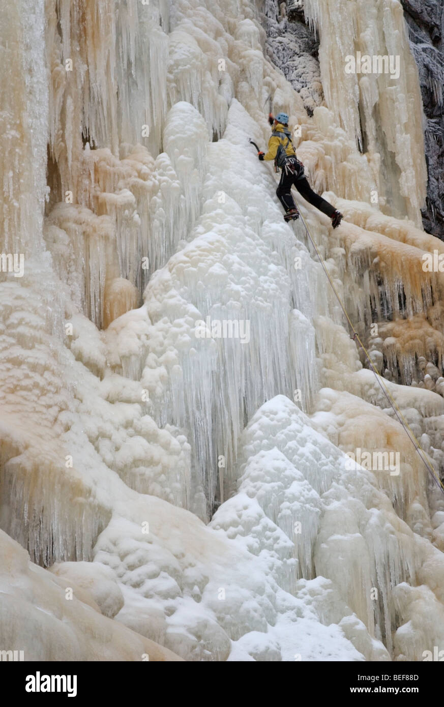 Man climbing ice fall hi-res stock photography and images - Alamy