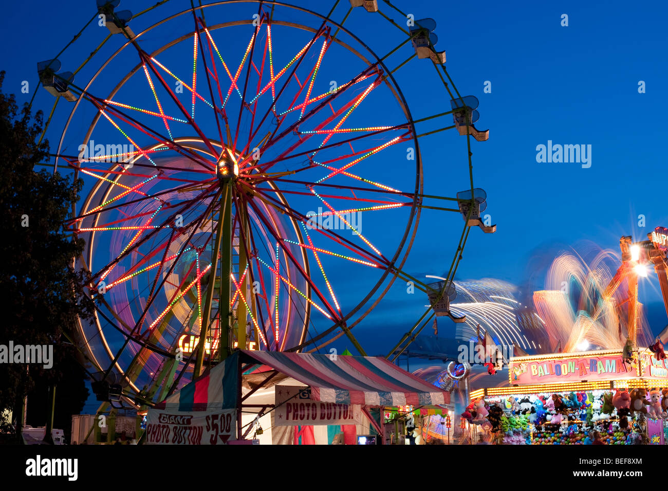 Evergreen State Fair at twilight with Ferris Wheel and amusement rides