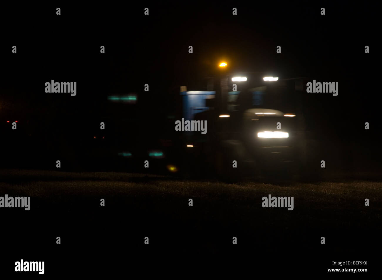 Tractor working at night Stock Photo Alamy