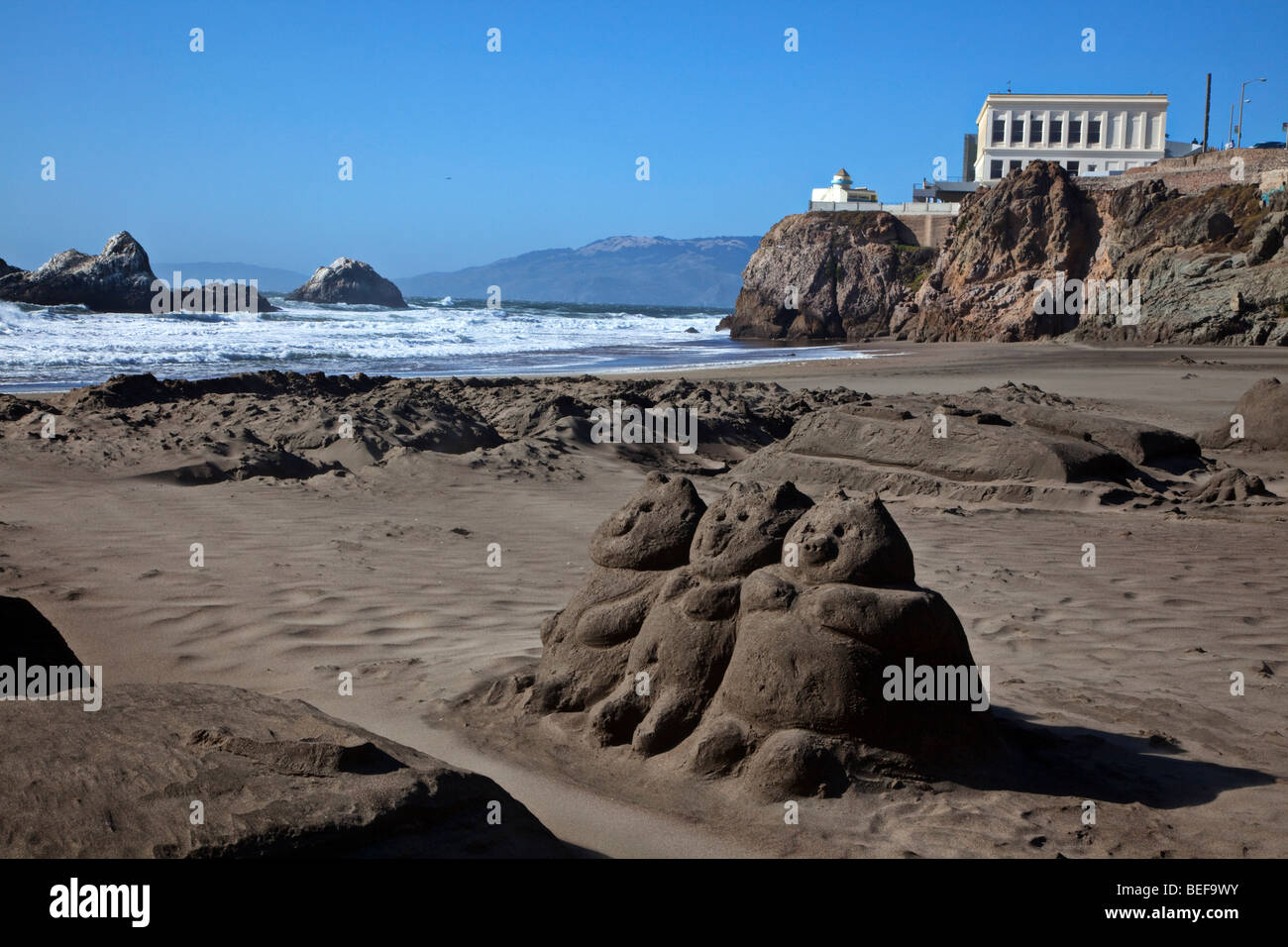 Three little pigs sand sculpture and Cliff House, Ocean Beach, San Francisco, California Stock Photo