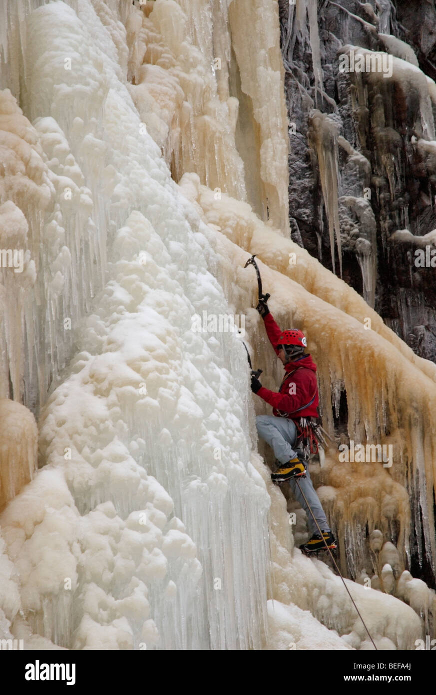 Man climbing ice fall hi-res stock photography and images - Alamy