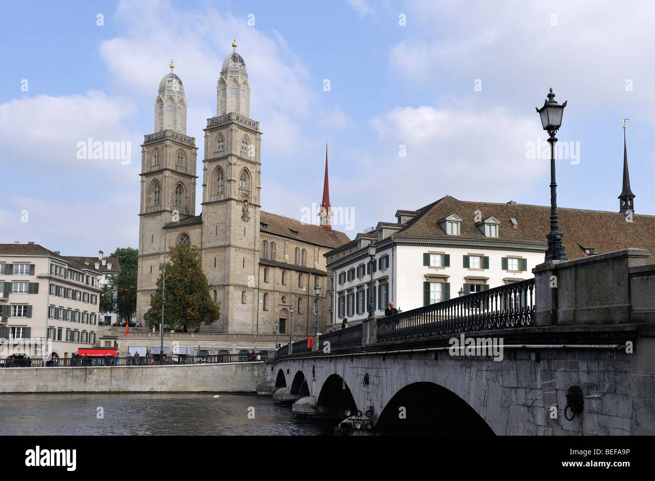 The twin spires of the Grossmünster tower over the River Limmat im Zurich, Switzerland Stock Photo