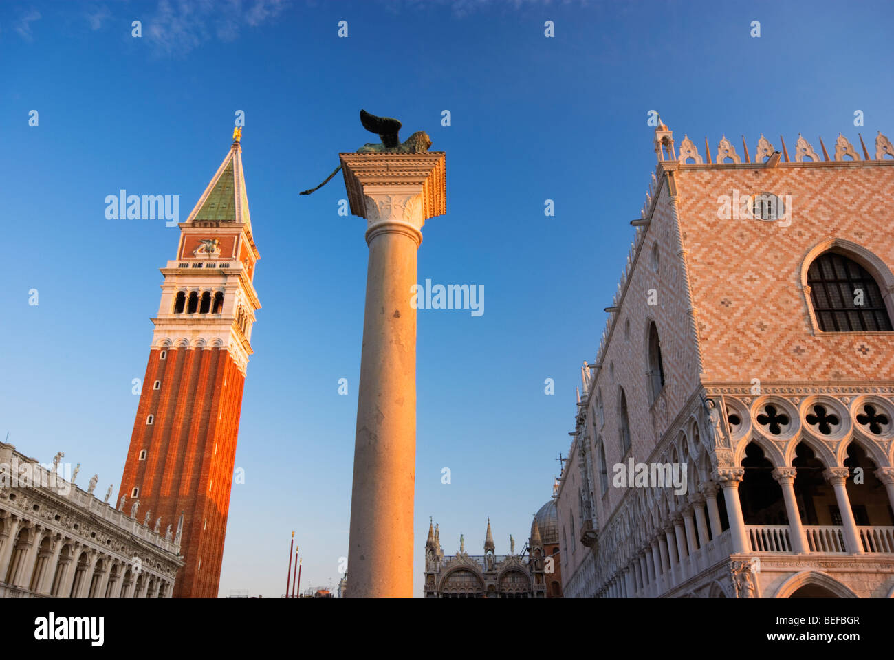 Horizontal View of The Piazza San Marco at sunrise, showing the Campanile, pillar and buildings Stock Photo