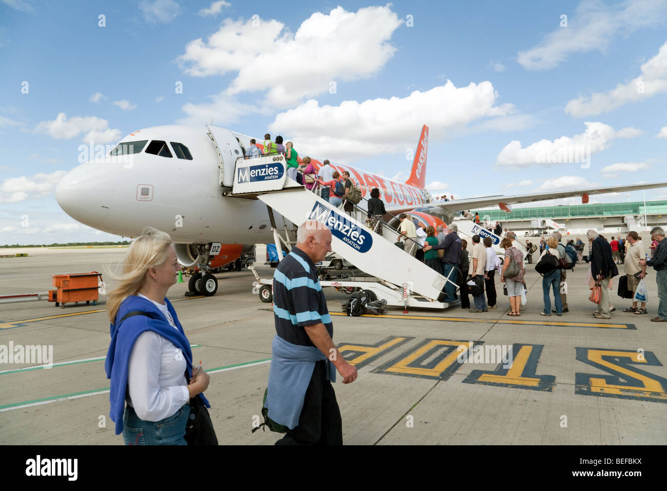 Passengers boarding an Easyjet plane at Stansted airport, UK Stock Photo Alamy