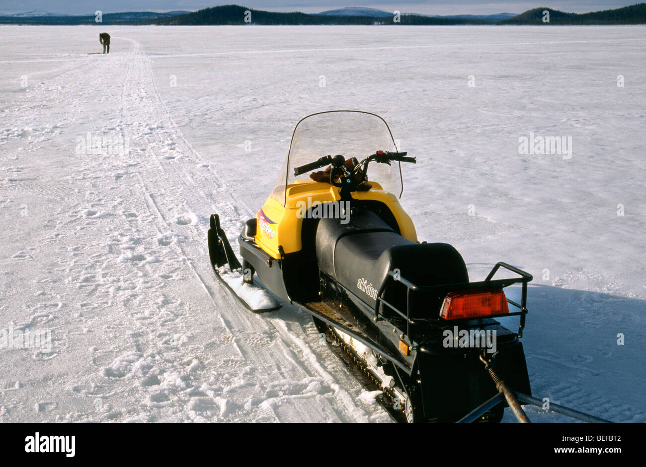 Sami fishing on the Ice, Inari, Lapland, Finland, Europe Stock Photo