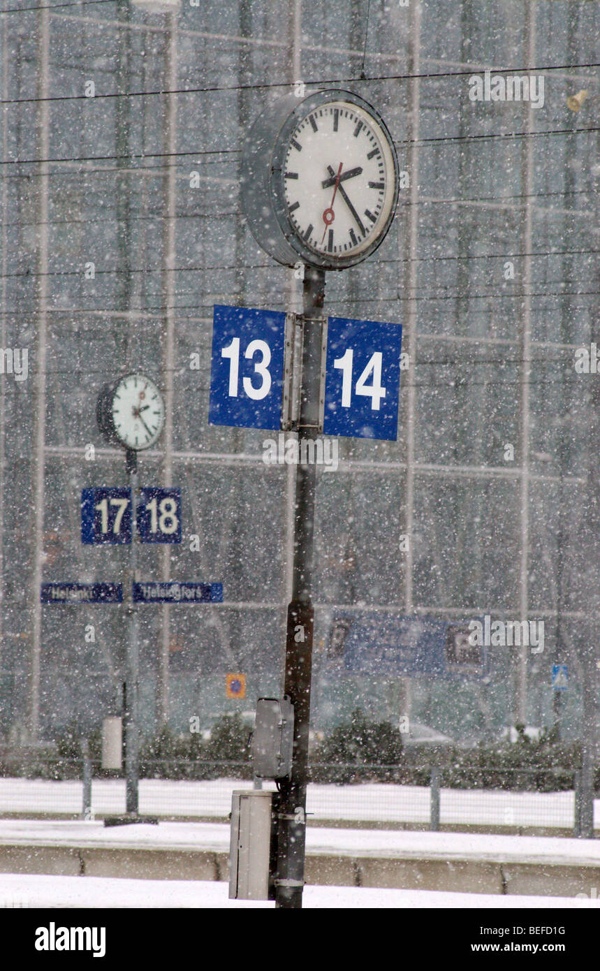 Clocks on Helsinki main railway station in winter Stock Photo Alamy