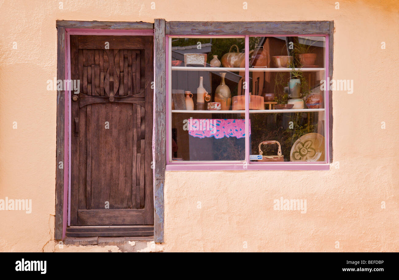The artful door and shop window of one of the many galleries in the arts and crafts town of Arroyo Seco, New Mexico. Stock Photo
