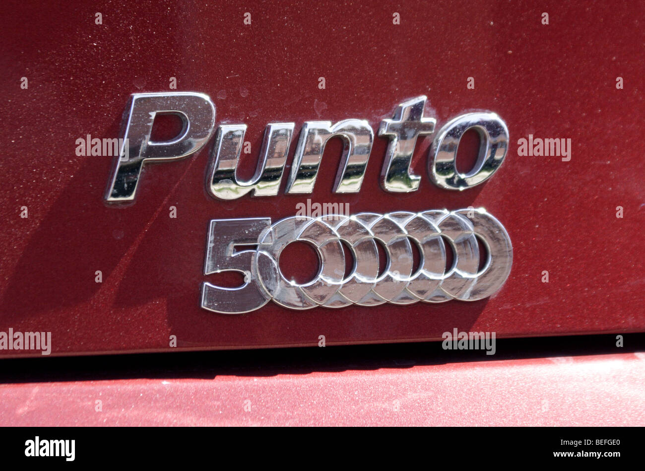 Fiat Punto boot badge depicting the 5 Millionth car produced Stock Photo Alamy