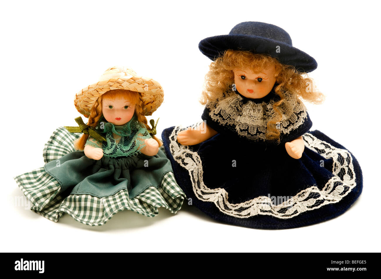 Old porcelain dolls on a white background Stock Photo