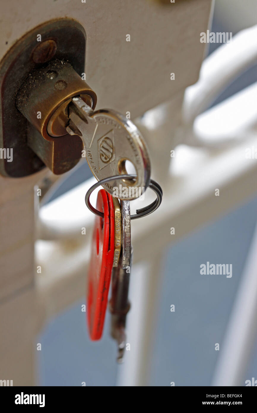 Bunch of keys hanging from lock on security gate of house in Cape Town