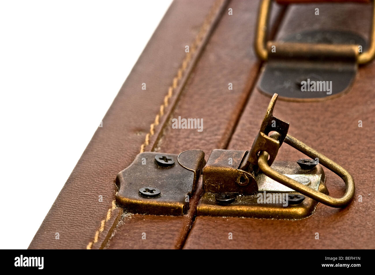 Old fashioned clasp on a brown leather briefcase in the open position. Stock Photo
