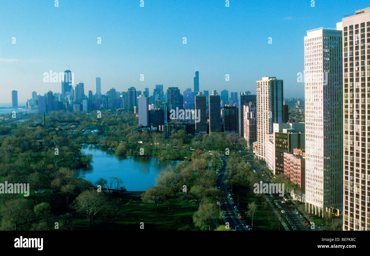 Chicago city skyline over park and lake with high rise apartment buildings Stock Photo