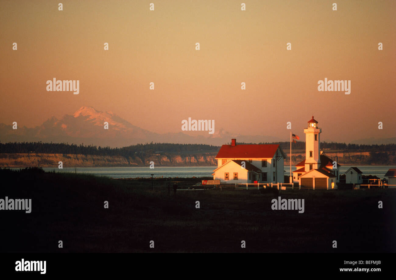 Point Wilson Lighthouse in Fort Worden State Park at sunrise near Port Townsend, Washington USA Stock Photo