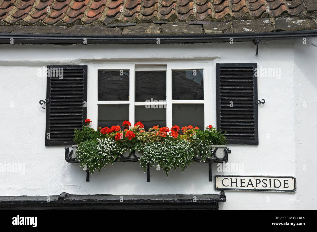 Close up of Shutters and window box on cottage house home in summer England UK United Kingdom GB Great Britain Stock Photo