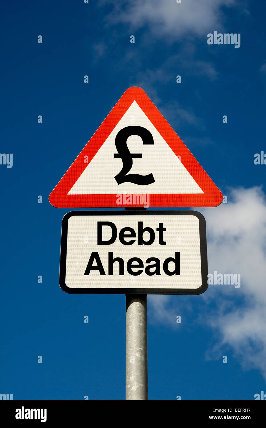 Digital concept of debt ahead with british pound symbol on a road sign close up Stock Photo