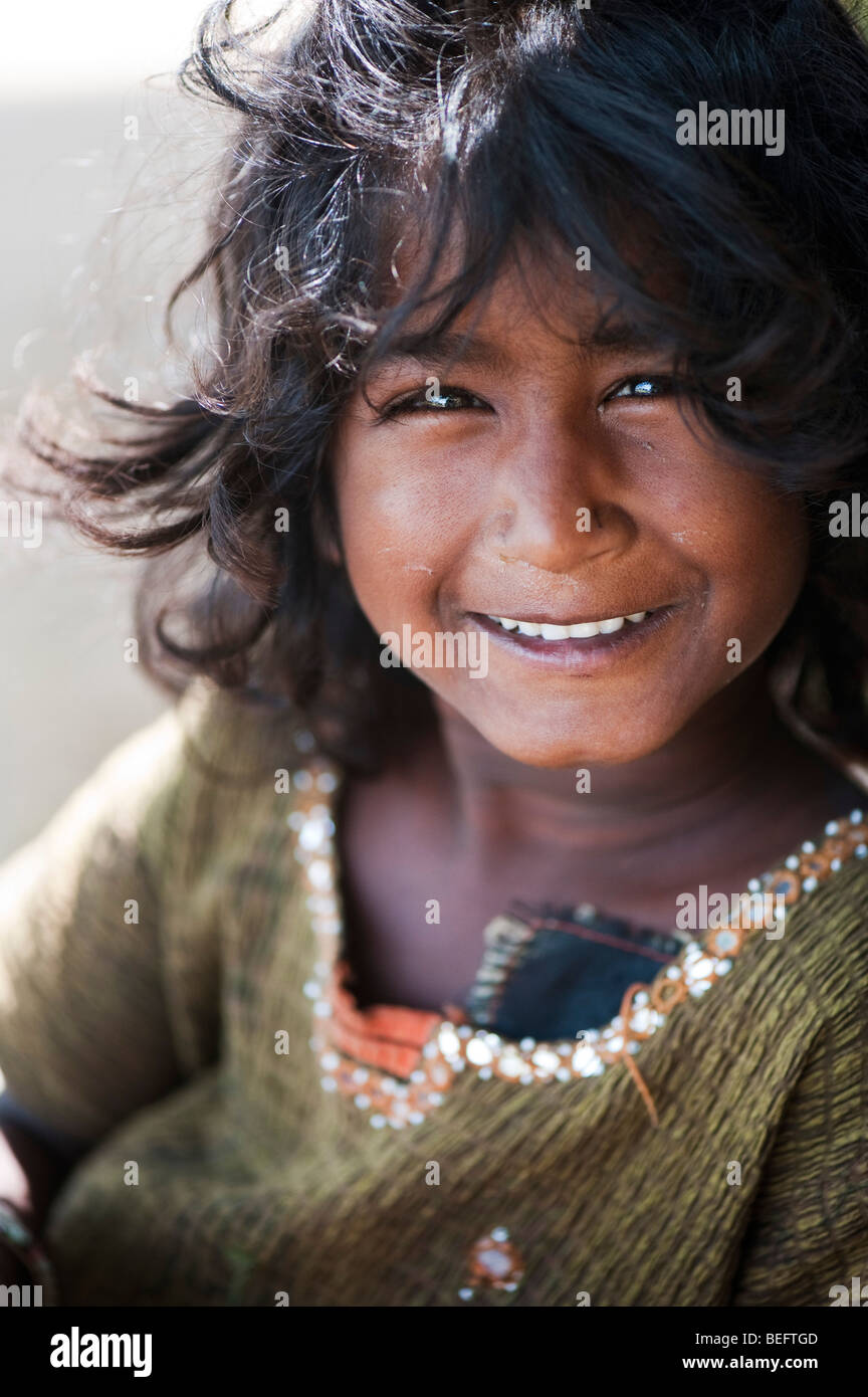 Happy young Indian street girl smiling Stock Photo