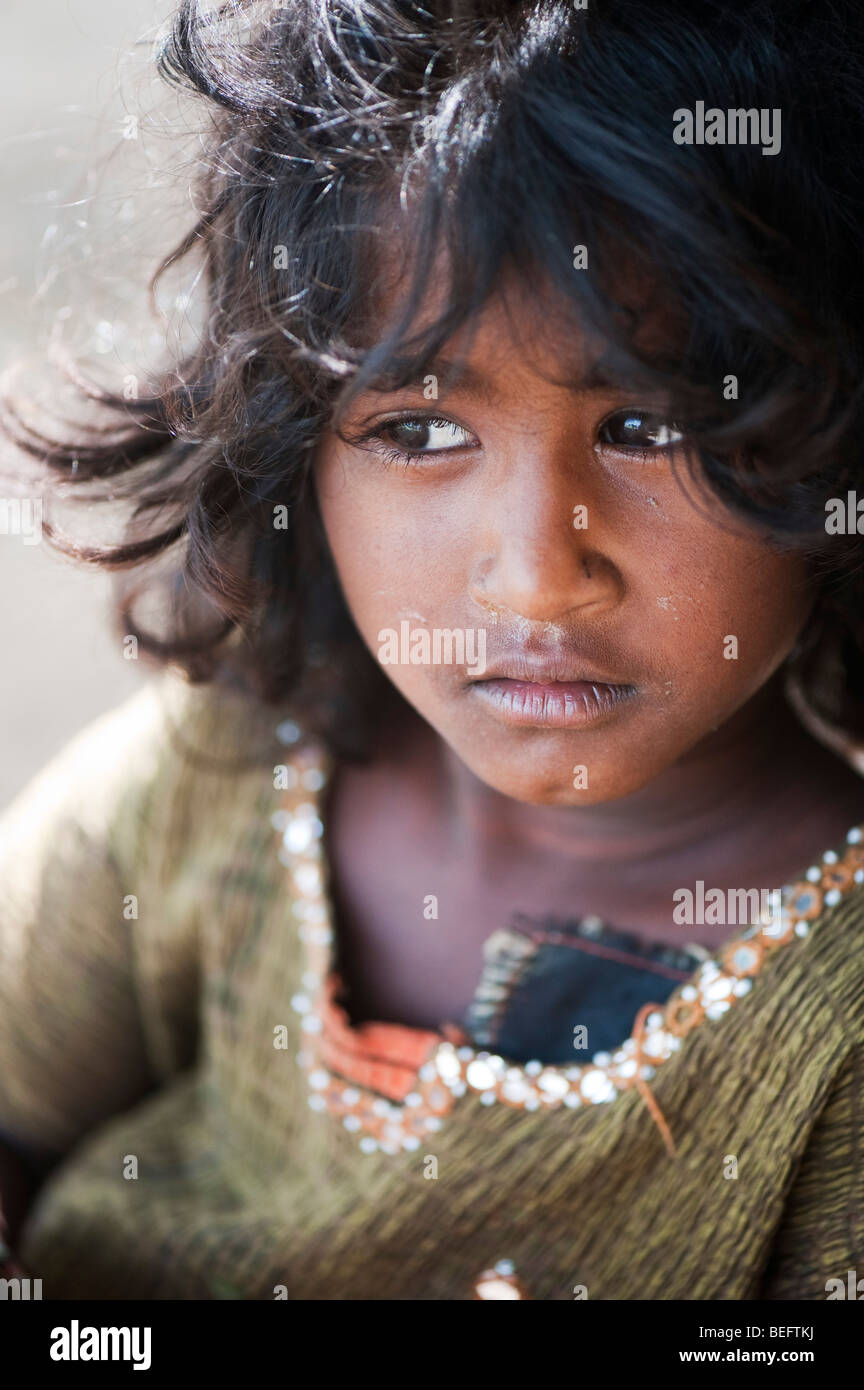 Young Indian street girl daydreaming. Selective focus Stock Photo