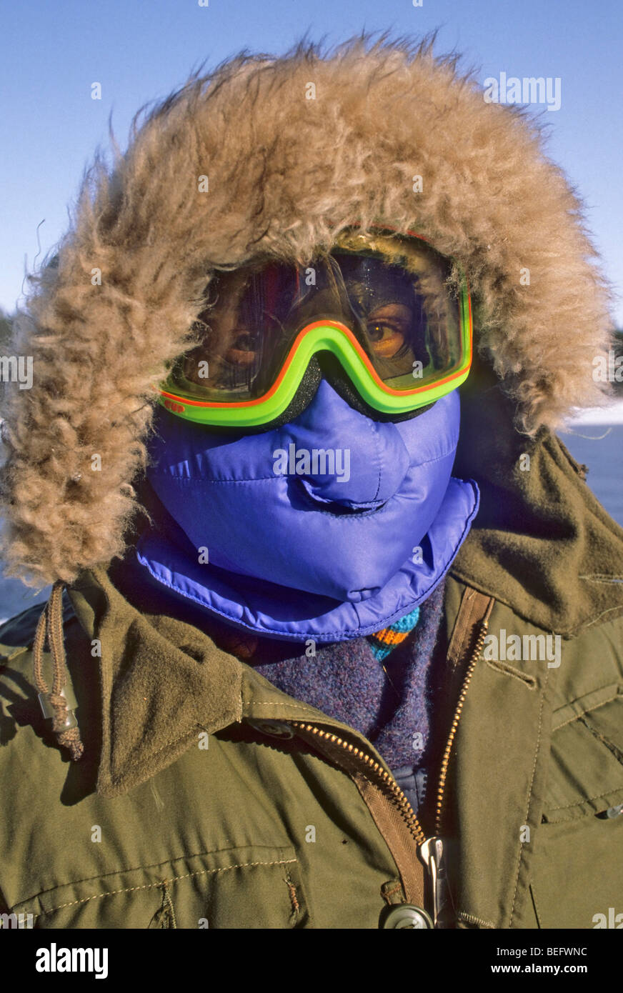 Man is bundled in heavy coat with fur lined hood and down face mask to  withstand minus 20 temperatures in Labrador, Newfoundland Stock Photo -  Alamy