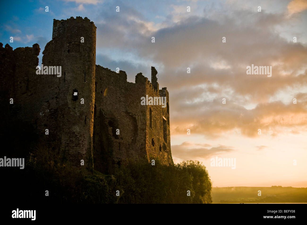 Laugharne Castle in West Wales at sunrise Stock Photo