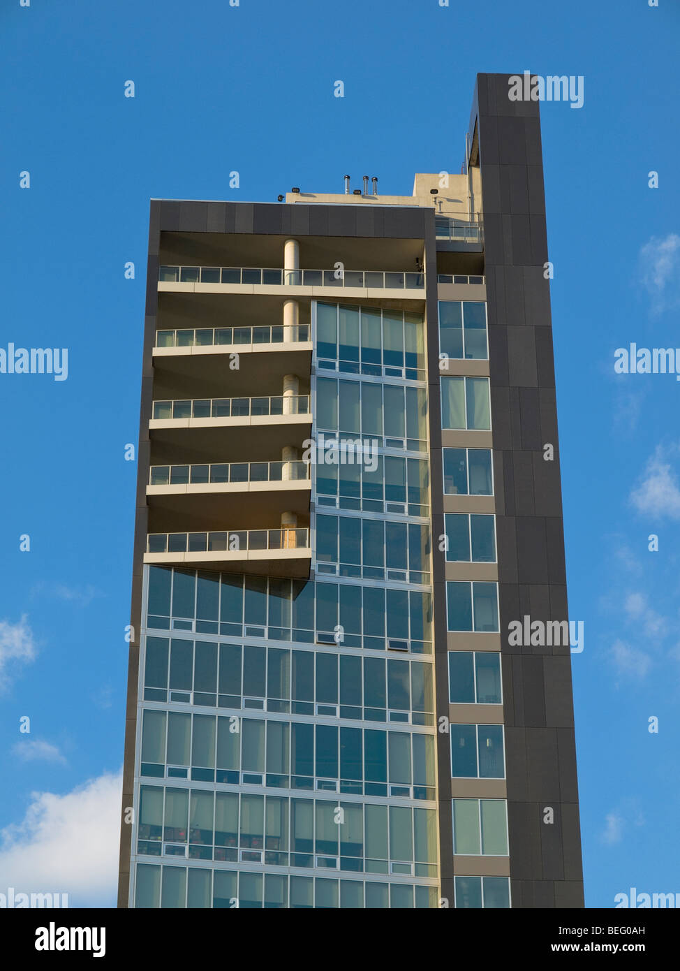 Modern west side loft building on blue sky background. Stock Photo