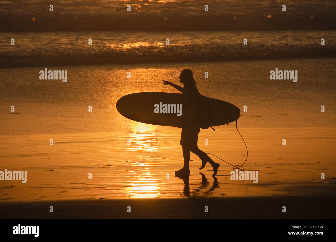 Surfer at sunset on the beach hi-res stock photography and images - Alamy
