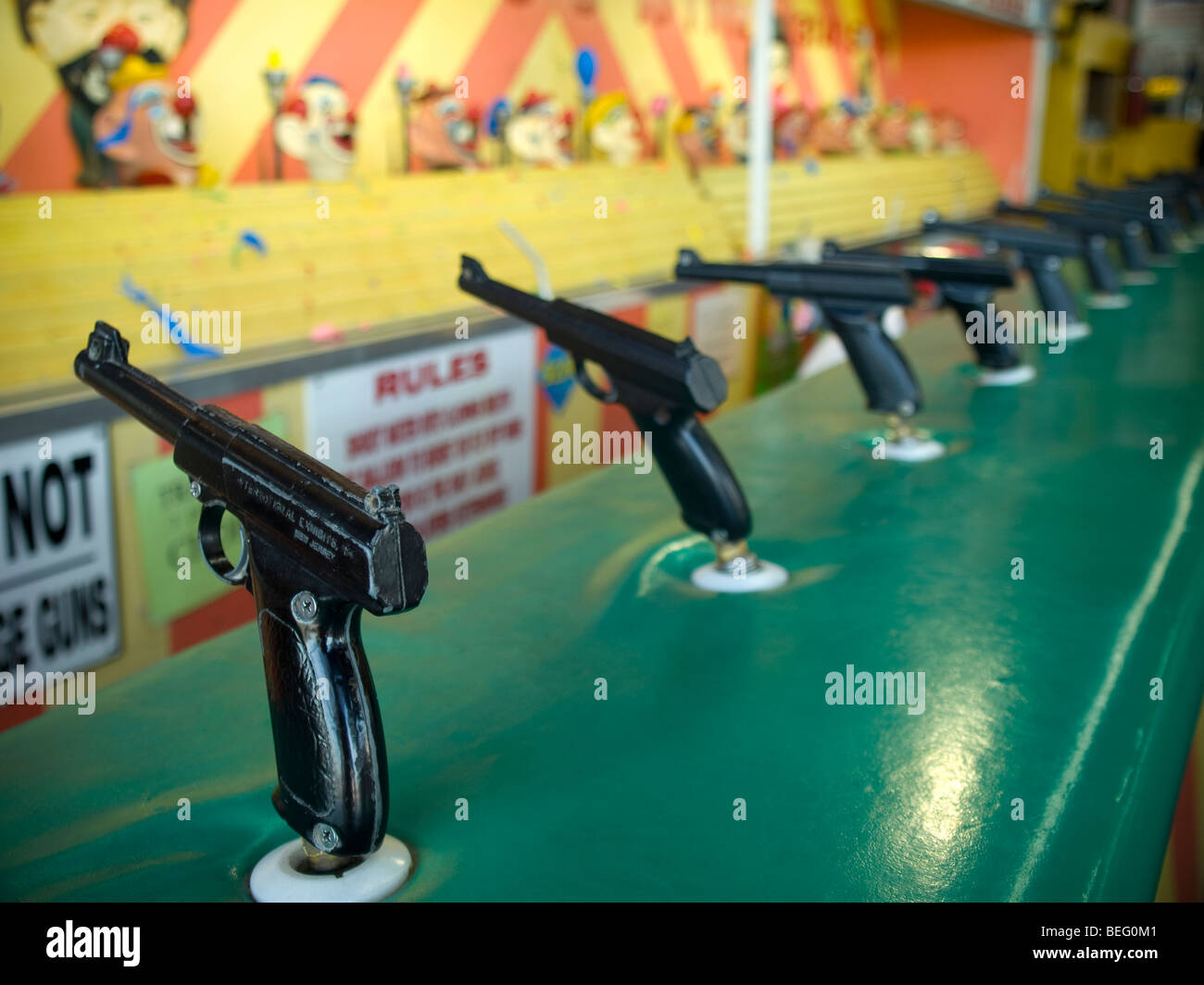 Aiming attraction with several wold war II styled toy guns Stock Photo