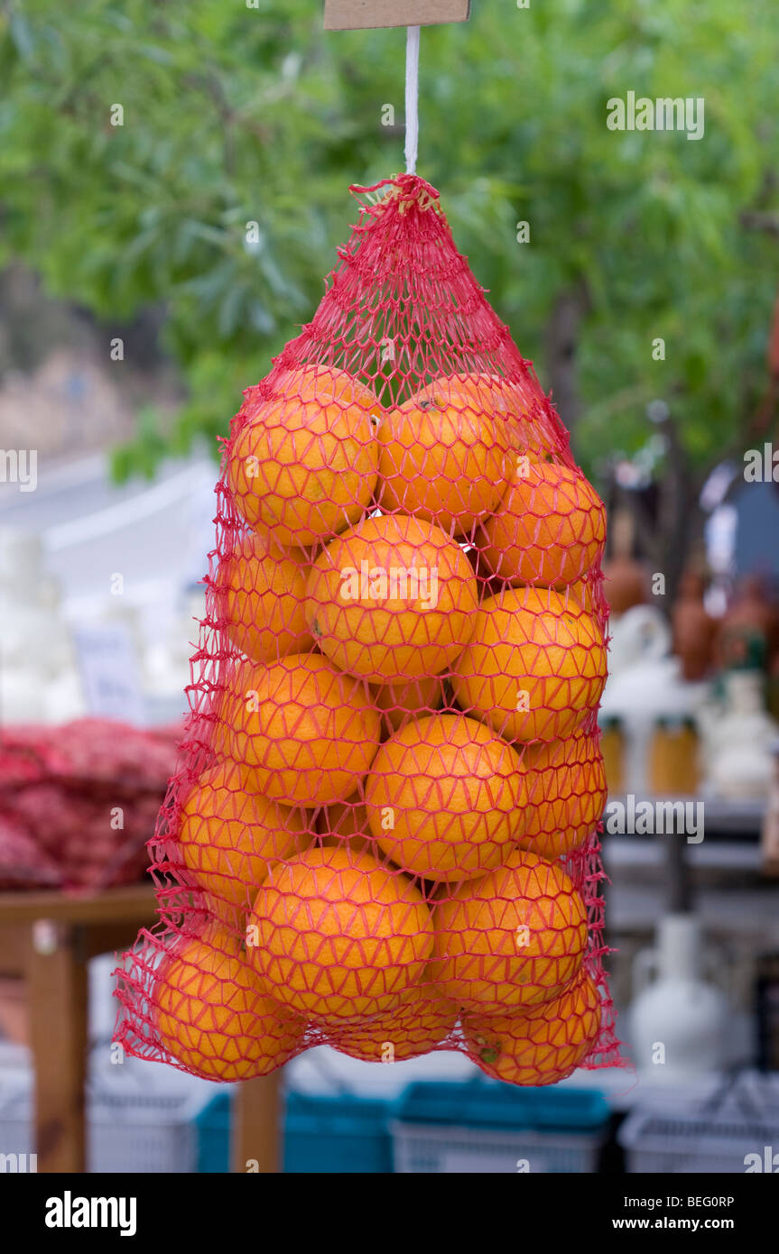 oranges hanging in a bag Stock Photo Alamy