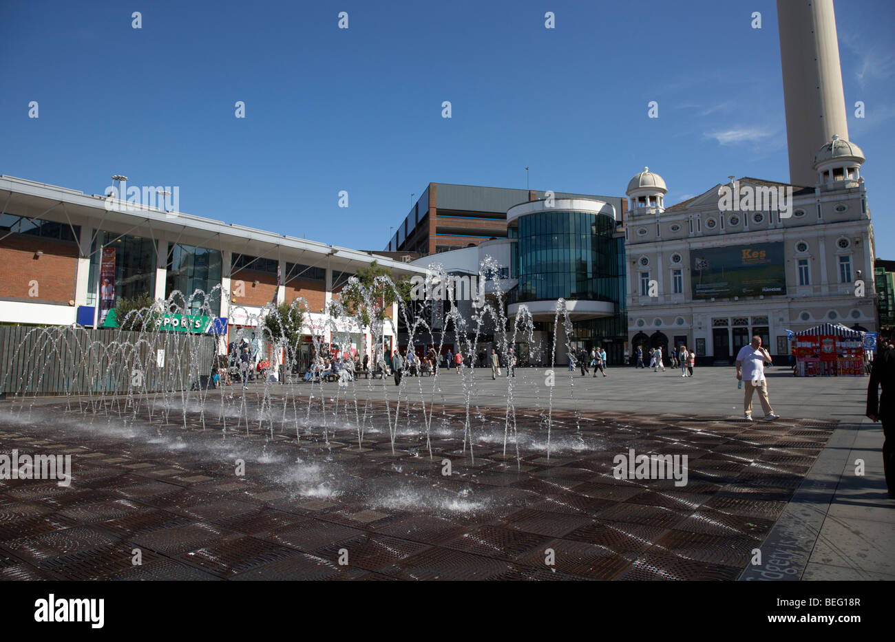 fountain water display in williamson square with the playhouse in the background in liverpool city centre liverpool Stock Photo