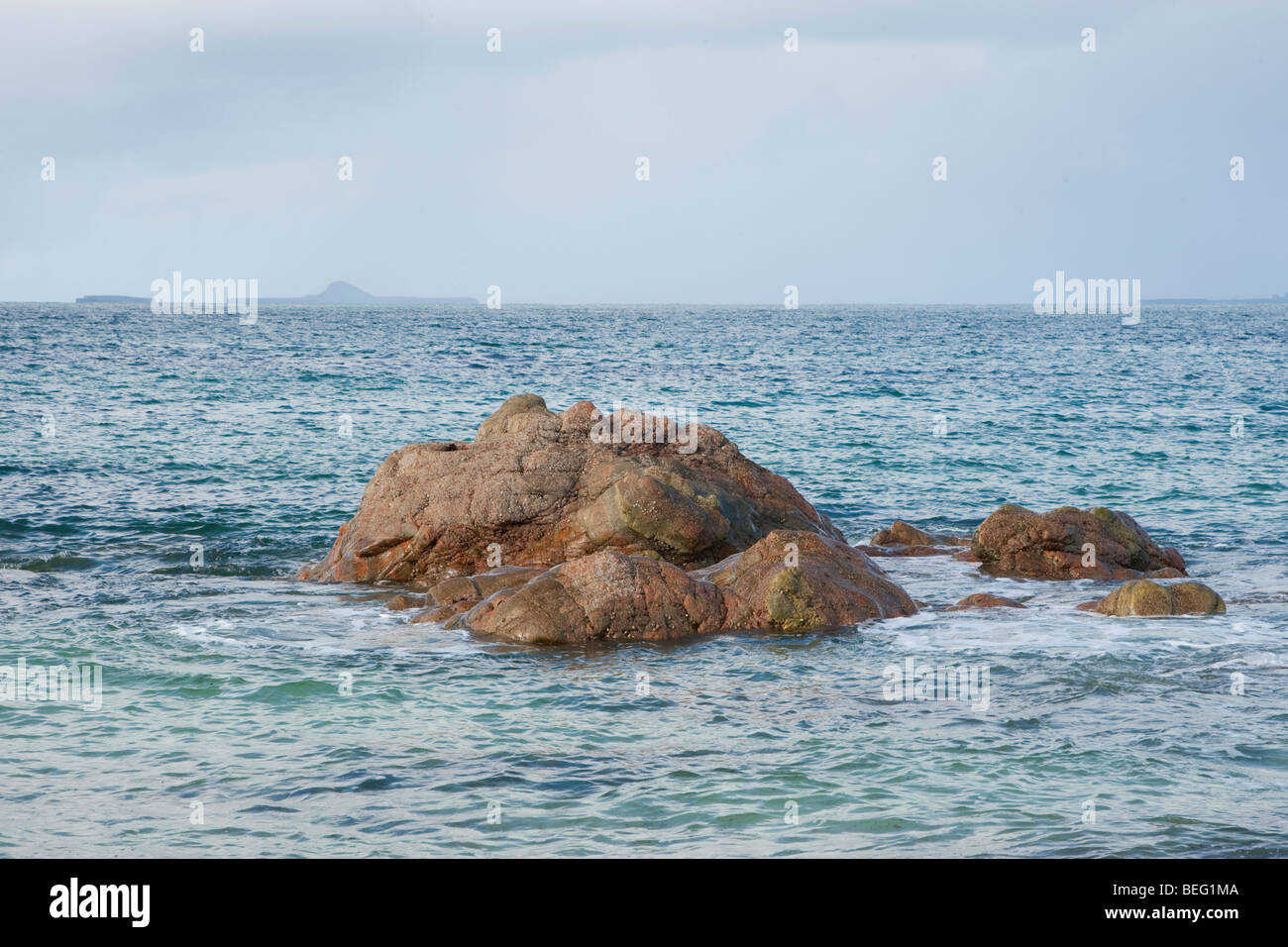 Rocks in coastal waters Stock Photo - Alamy
