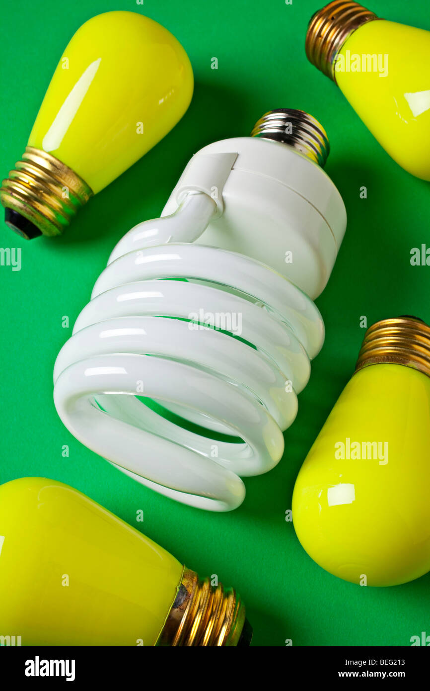 Energy light bulb and yellow light bulbs on green background Stock ...