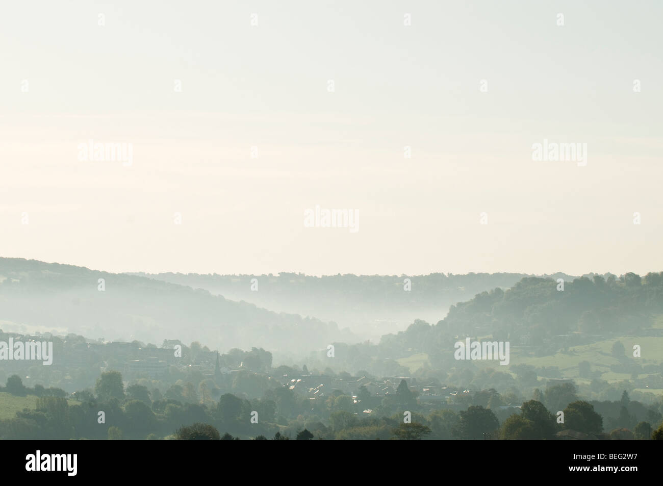 Stroud town from a distance shrouded in early morning mists Stock Photo