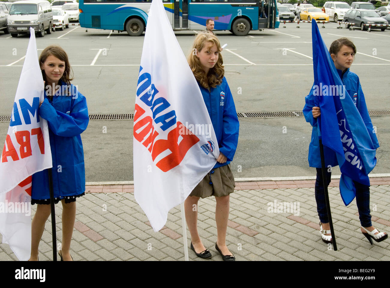 Cheer squad from United Russia party awaiting a visiting delegation at Vladivostok Stock Photo