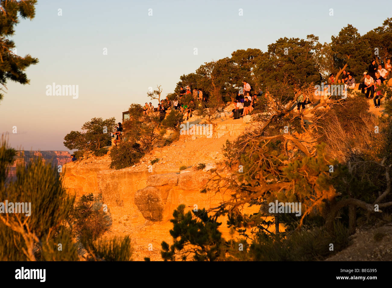 Tourists await sunset at an overlook at the Grand Canyon, Arizona Stock Photo