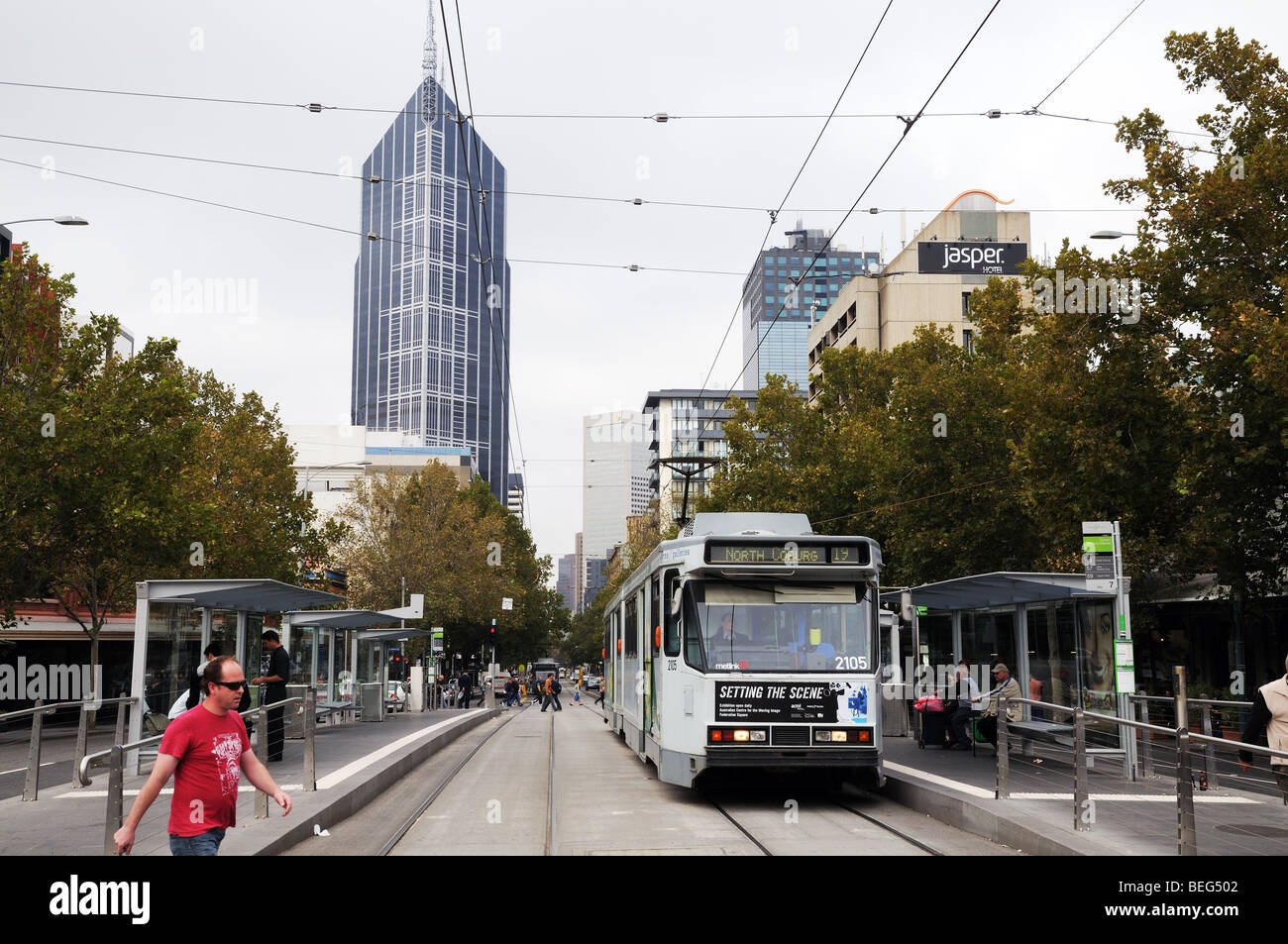 Swanston Street Melbourne Australia with tram lines high rise buildings pedestrians and traffic Stock Photo