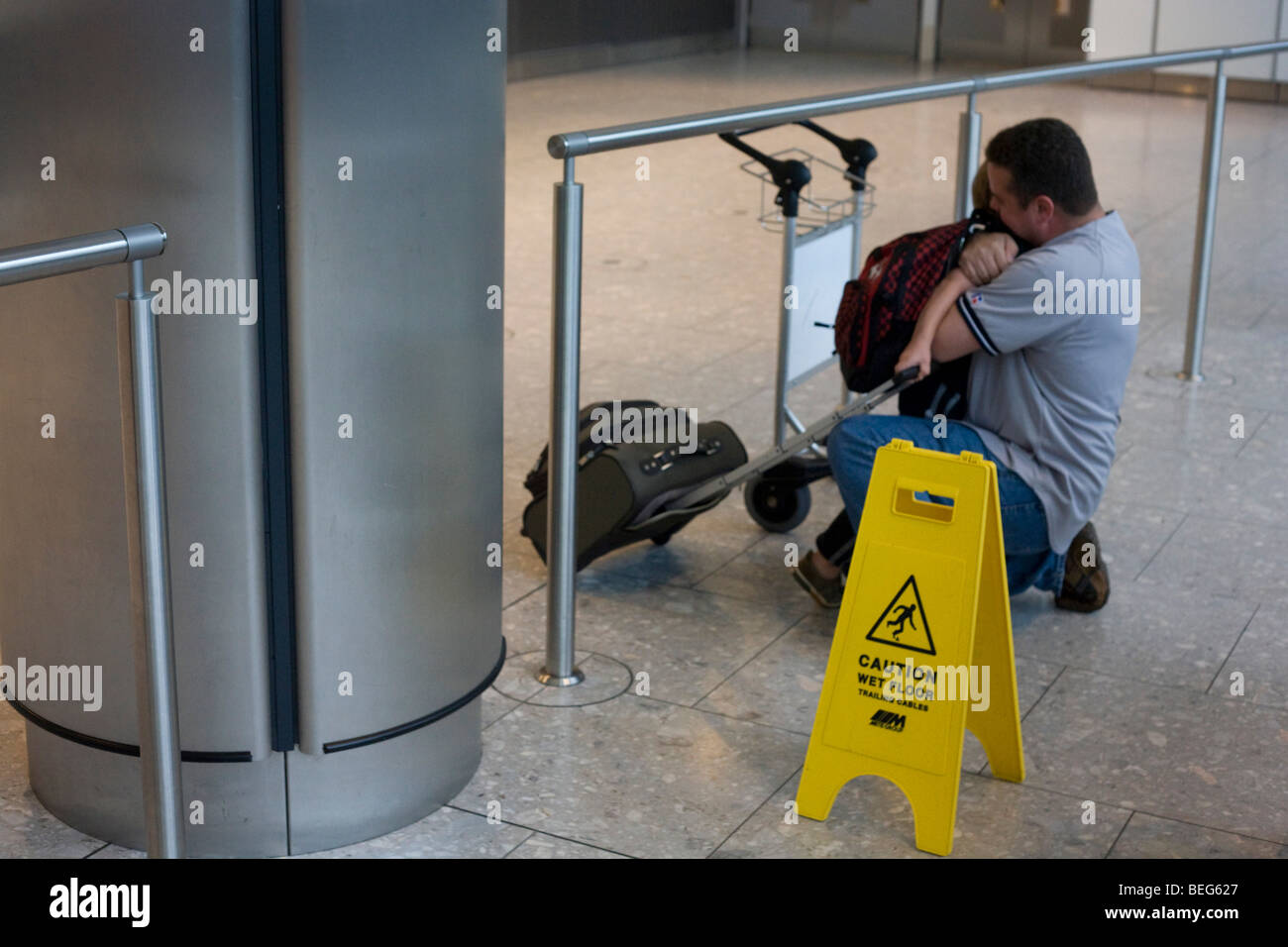 Greeting dad and son in International Arrivals concourse at Heathrow's terminal 5. Stock Photo