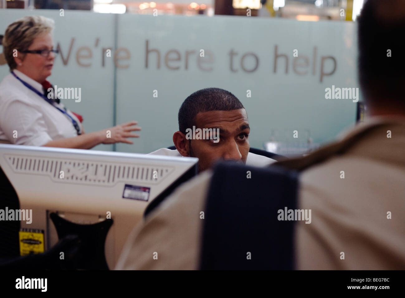 Members Of Staff At The British Airways Information Desk In Stock