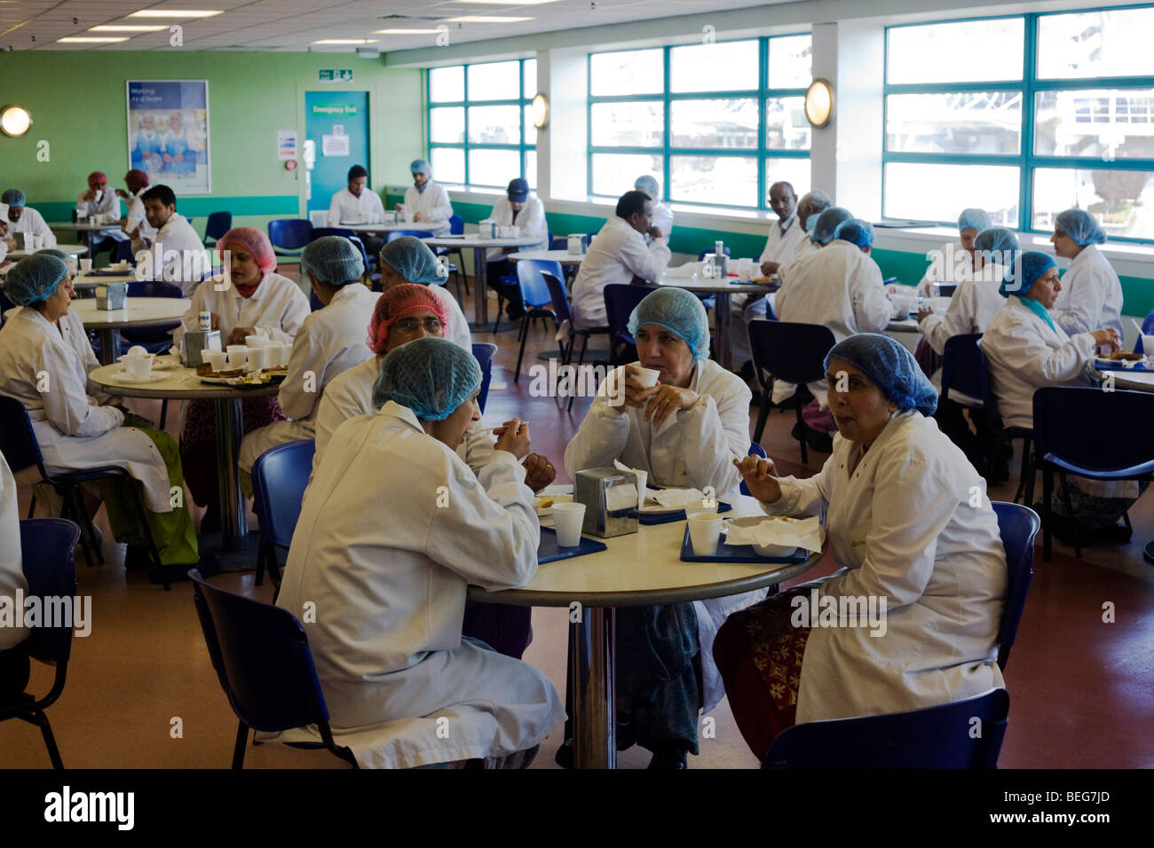 Employees of the airline in-flight meals production company Gate Gourmet take break in company canteen at Heathrow Airport Stock Photo