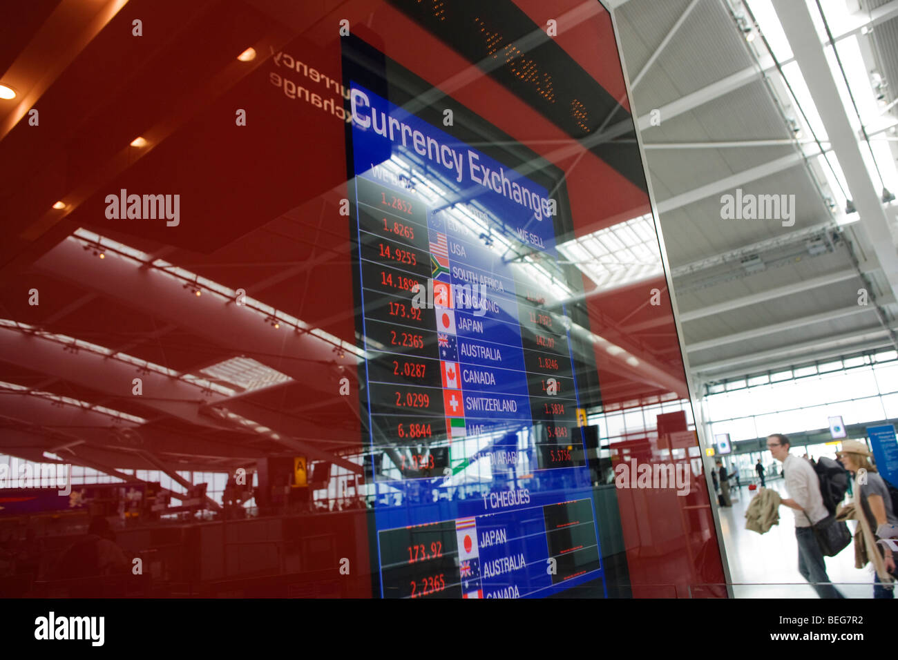 Money retailer Travelex foreign currency rates displayed at Heathrow's Terminal 5. Stock Photo