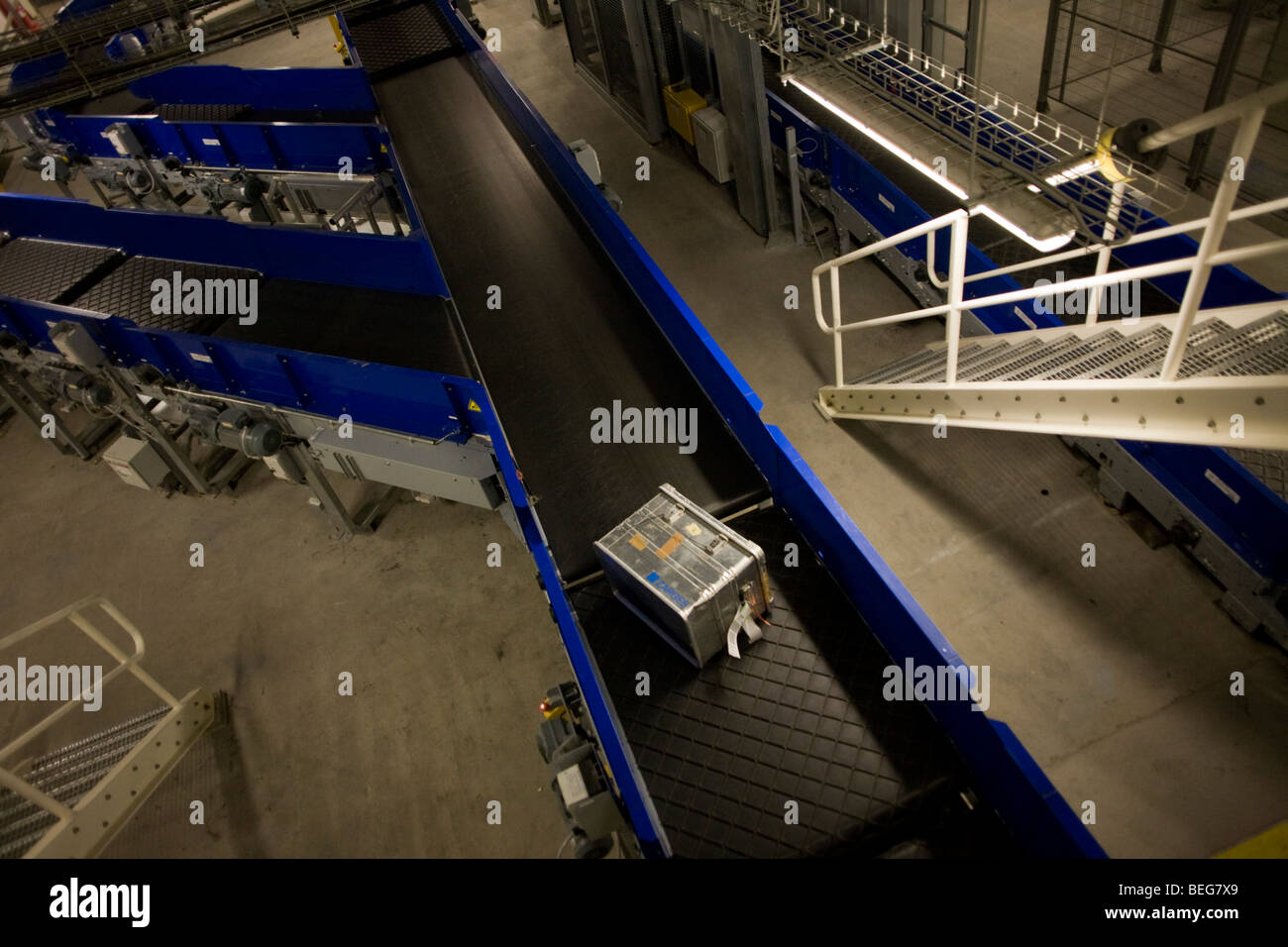Baggage travels down some of the 11 miles of conveyor belts Terminal 5 at Heathrow Airport. Stock Photo